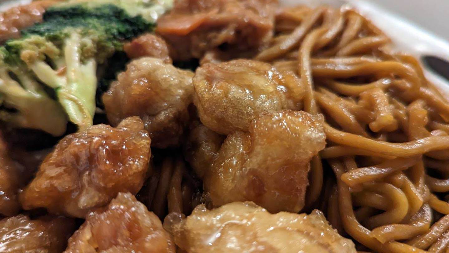 Here is orange chicken with lo mein noodles and broccoli and chicken in the background from the China Experience at Louis Joliet Mall in Joliet.