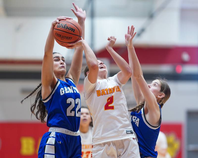 Geneva’s Leah Palmer (22) blocks a shot by Batavia's Brooke Carlson (2) during a basketball game at Batavia High School on Friday, Jan 26, 2024.