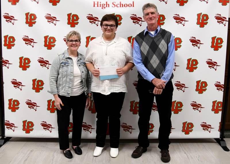 Max Wertz (middle) received the Andrew J. Kelly Memorial Scholarship presented by Andrew Kelly's parents, Terri and Bill Kelly. The $300 scholarship is awarded to La Salle-Peru High School's senior class president with plans of attending college or vocational school.