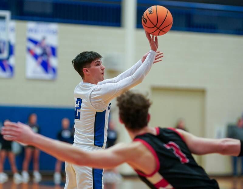 Geneva’s Gabe Jensen (2) shoots a three pointer against Batavia during a basketball game at Geneva High School on Friday, Feb. 7, 2025.