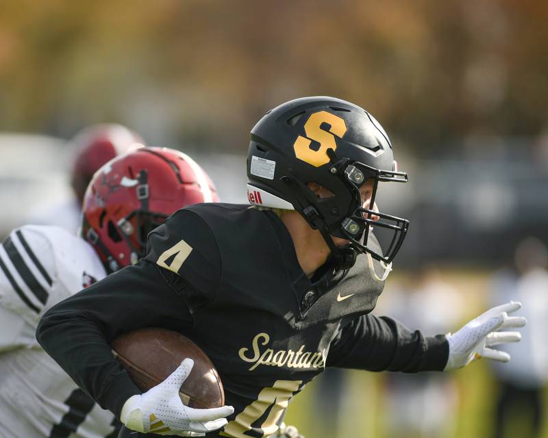 Sycamore's Aidan Wyzard (4) runs with the ball during the game on Saturday Nov. 2, 2024, while taking on Chicago Bulls College Prep in week one of the class 5A playoff held at Sycamore High School.