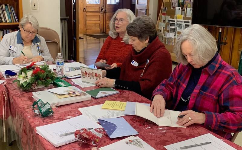 Signing Christmas cards for vets: Alice Giberson, Ruth Meinhardt, Leslie Althaus, Lonnie Schaefer