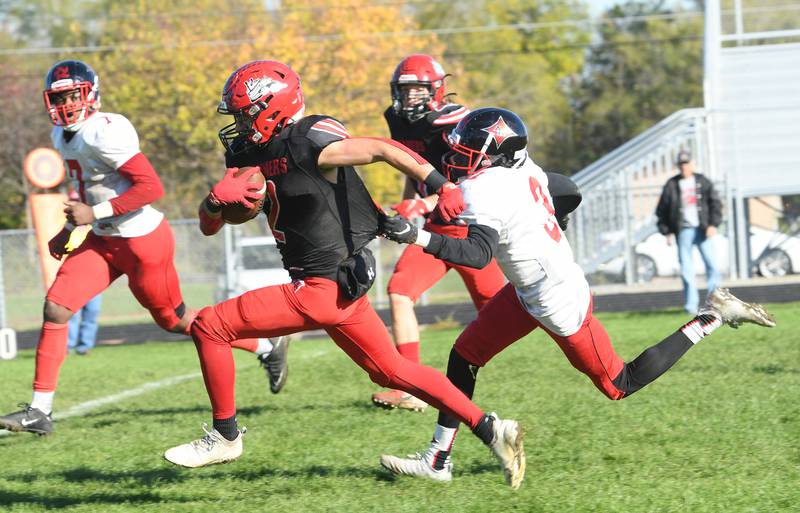 Fulton's Brock Mason runs for gain against Chicago Raby.