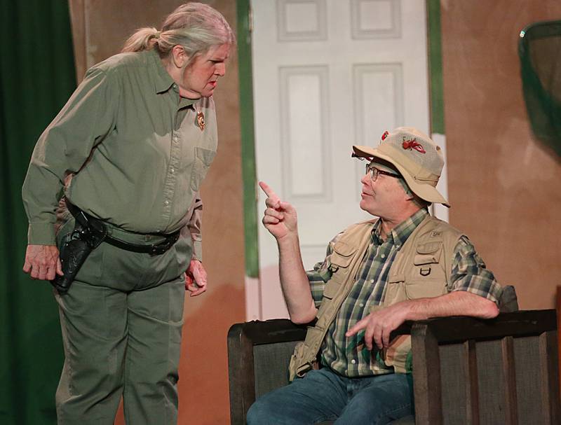 Maxie Wilburn Suggs, played by Karen Leighfeit and Gene Wilburn played by Larry Kelsey act out a scene in "Farce of Nature" at Stage 212 on Tuesday, Nov. 1, 2022 in La Salle.