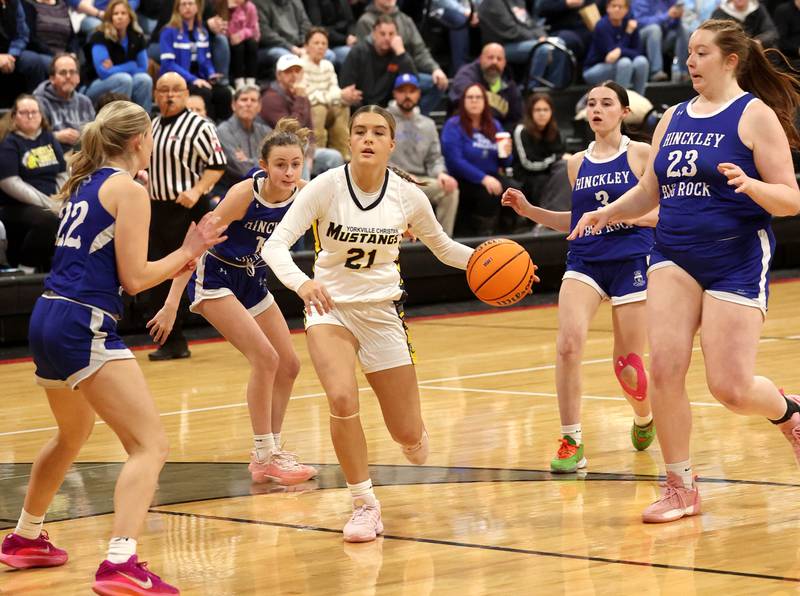 Yorkville Christian’s Danielle Bulson drives between four Hinckley-Big Rock defenders during their Class 1A regional game Tuesday, Feb. 17, 2025, at Indian Creek High School in Shabbona.