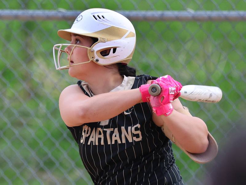 Sycamore's Kairi Lantz watches her homerun sail over the fence Friday, April 17, 2026, during thier game against Ottawa at Sycamore High School.