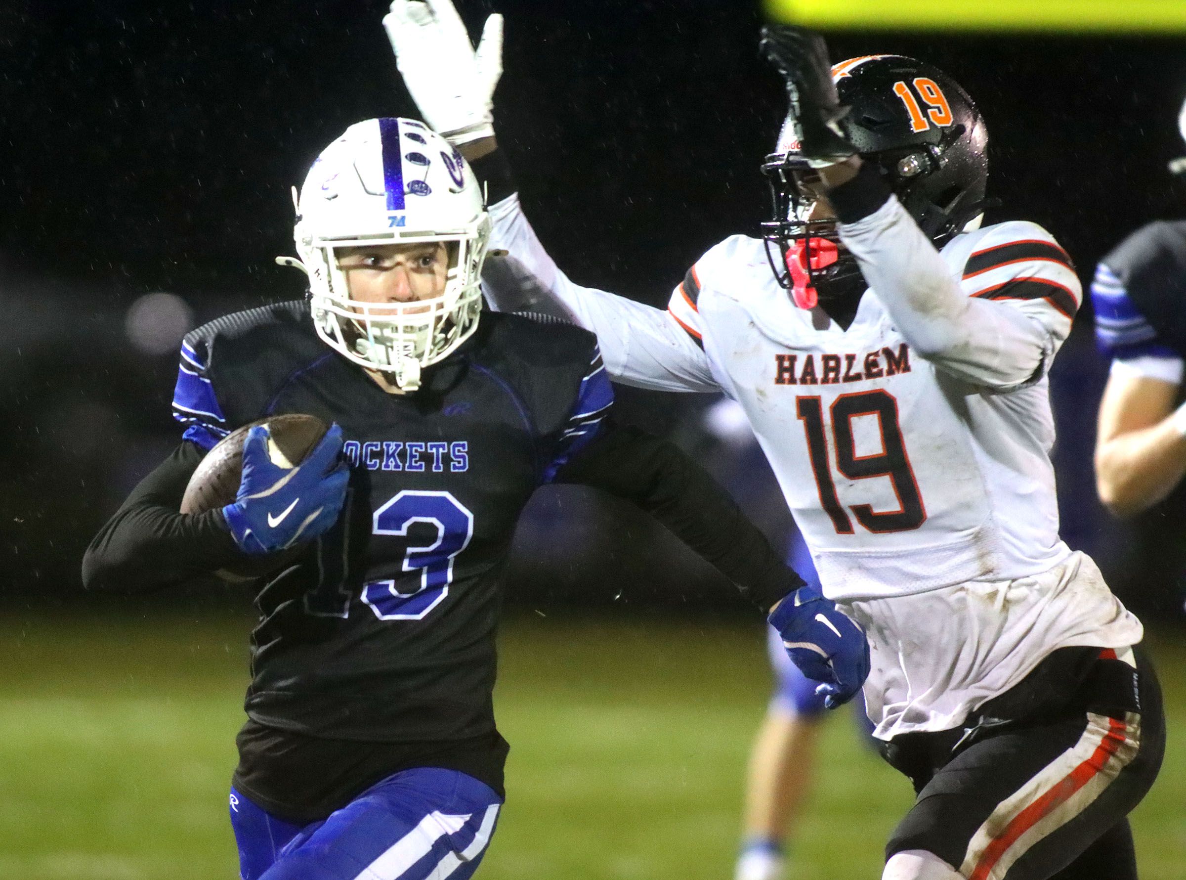 Burlington Central’s James Wagner Viebrock moves the ball against Harlem in IHSA football Class 6A second-round playoff action at Central High School in Burlington on Saturday, November 8, 2025.