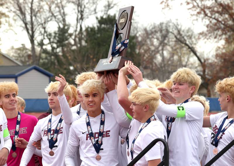 Prairie Ridge players celebrate Saturday, Nov. 9, 2024, after beating Lemont in the Class 2A state third place game at Hoffman Estates High School.
