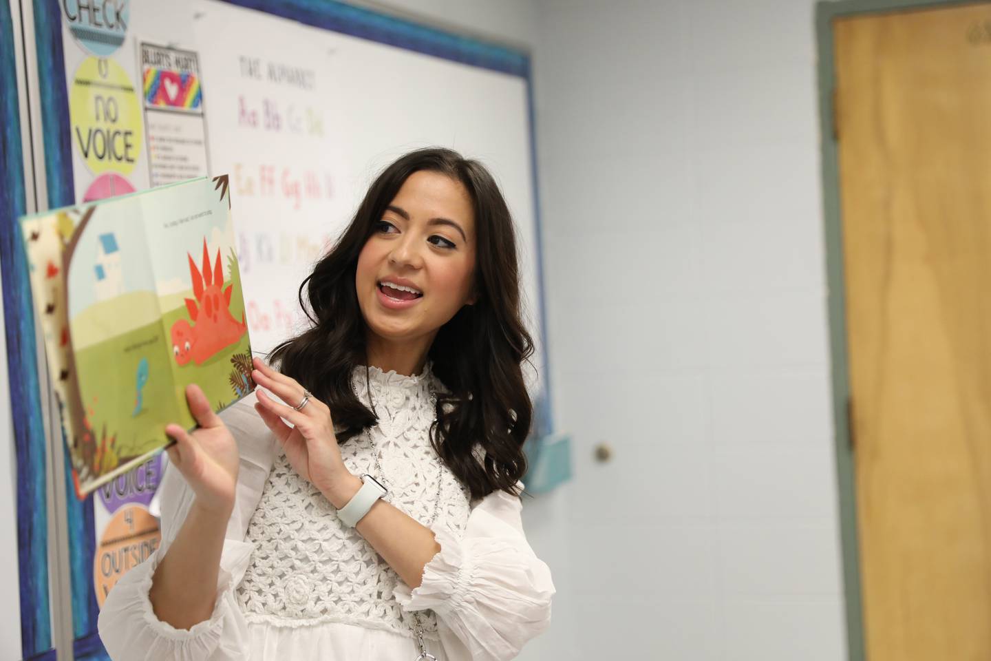 Ashley Honn, a teacher librarian/interventionist  at Henry Puffer Elementary School in Downers Grove, reads a story to second graders. Honn was honored with a a Green Apple Award through the Education Foundation of Downers Grove District 58.