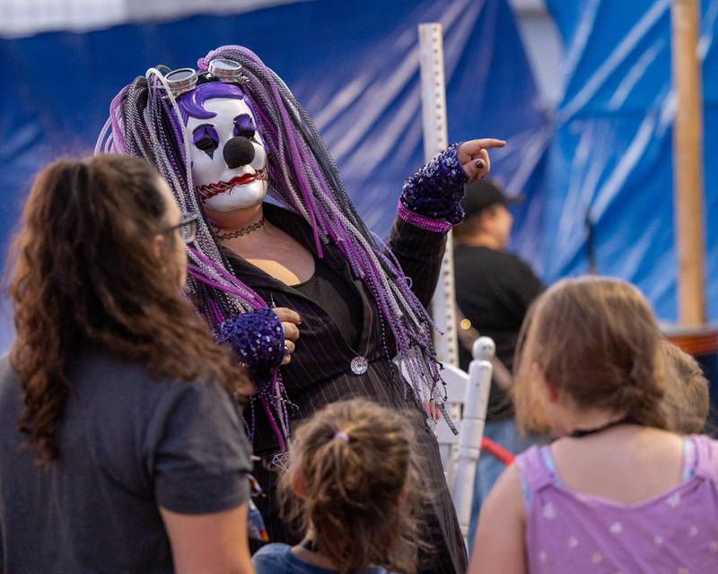 Haunted house performer shows kids how to enter the haunted attraction at the Monster Mash Balloon Bash on Saturday, Oct. 4, 2025 at the Bureau County Fairgrounds in Princeton.