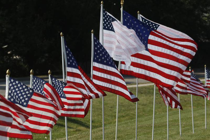 American flags, put up by True Patriots Care, surround McHenry Township Fire Protection District Station 2 on Johnsburg Road in Johnsburg on Thursday, Sept. 11, 2025. The Flags of Honor is on  display at Station 2 through September 15. This exhibit honors the 343 brave firefighters who lost their lives during the tragic events of September 11, 2001, with each flag symbolizing their courage and sacrifice.