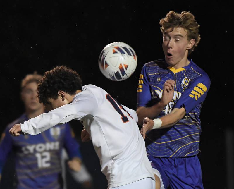 Naperville North’s Niko Ladas and Lyons Township’s Haris Sarajlija compete for the ball in the Class 3A state soccer semifinal game in Hoffman Estates on Friday, November 3, 2023.