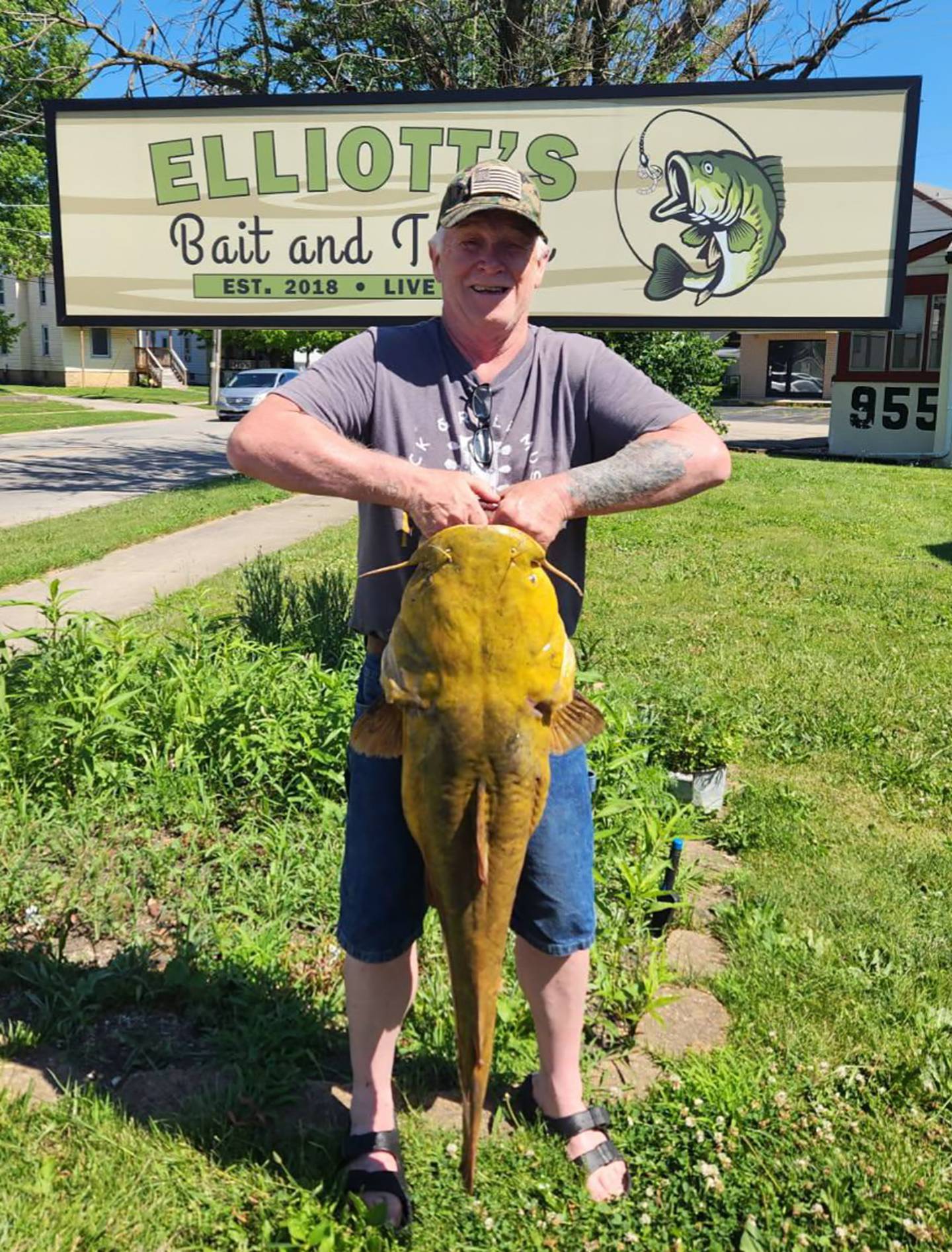James Swisher, of Kankakee, holds the flathead catfish he caught weighing in at 40 pounds, 11 ounces. The catch tops the Kankakee River Fishing Derby Big Board in the category.