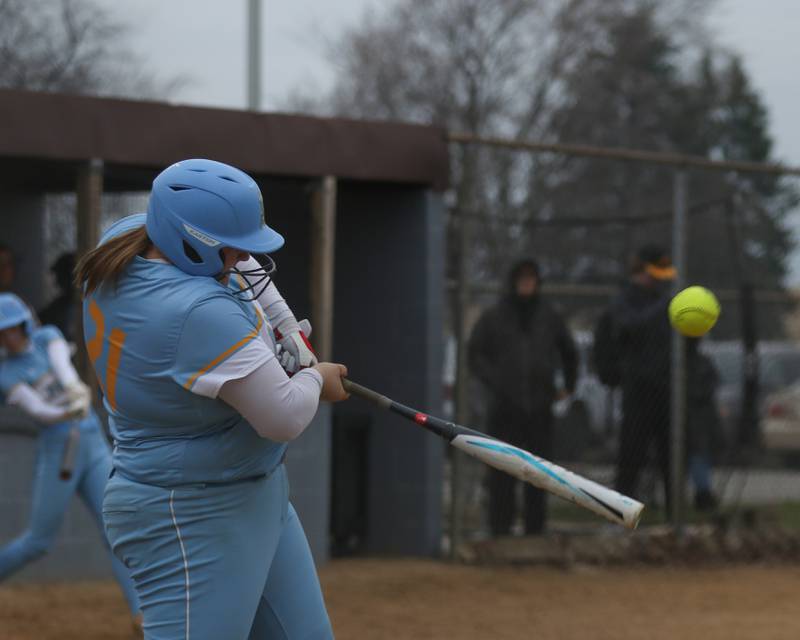Joliet Catholic's Nina Sebahar (21) connects on a pitch during softball game between Joliet West at Joliet Catholic on Thursday, March 27, 2025  in Joliet.
