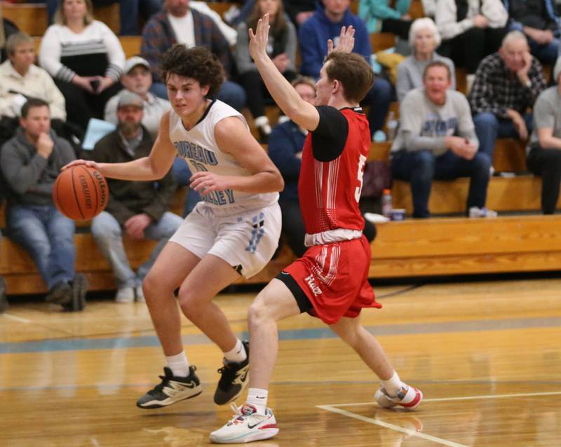 Bureau Valley's Logan Philhower looks to pass the ball while being guarded by Hall's Caleb Bickett on Friday, Jan. 19, 2024 at Bureau Valley High School.
