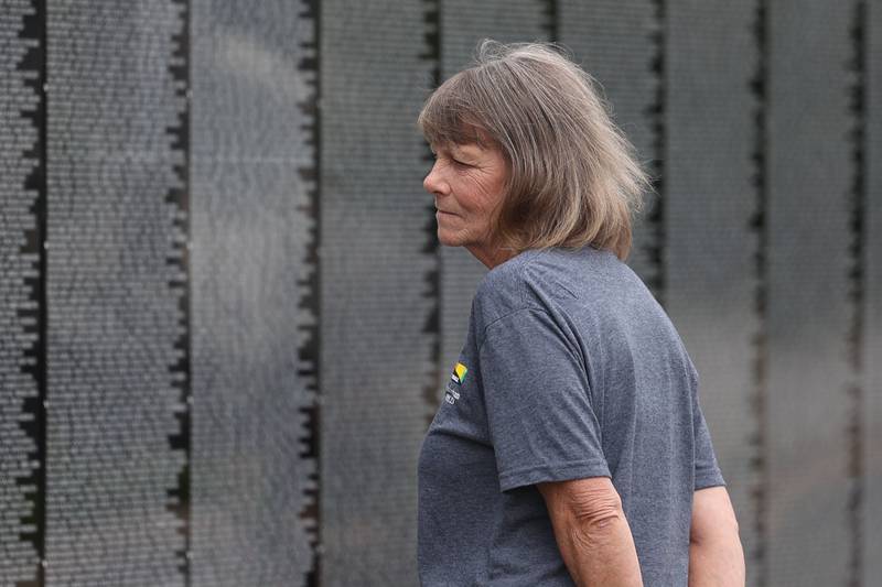 Kathy Heath looks for her uncle, Army Major Roger Lee Pierce, on the Vietnam Moving Wall on Saturday, July 1st, 2023, in Manhattan.