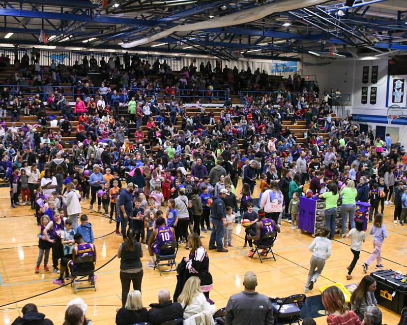 Young fans wait to get autographs from the Harlem Wizards during halftime of the basketball game on Sunday Jan. 19, 2025, held at Downers Grove South High School.