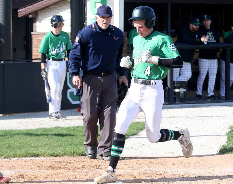 Seneca's Austin Aldridge steps on home plate to score a run against Streator on Friday, April 19, 2024 at Seneca High School.