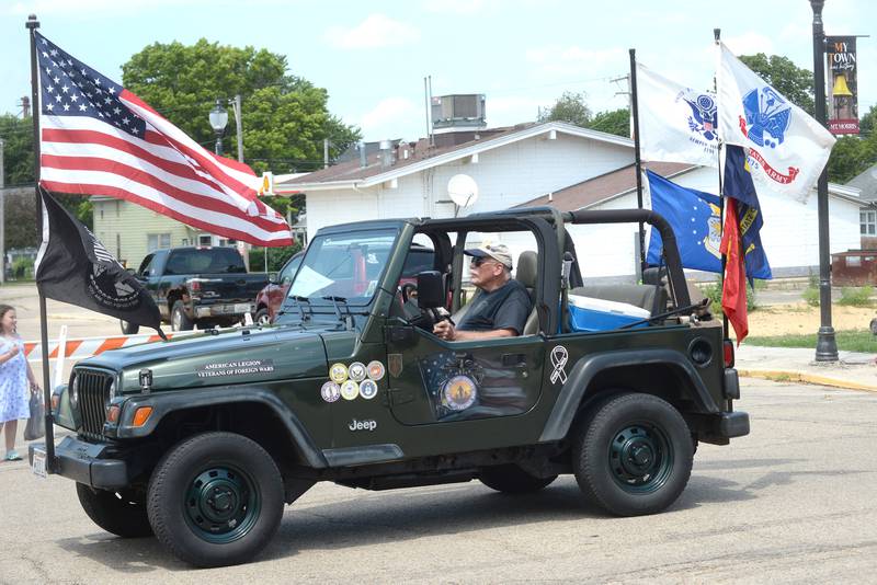 Vietnam War veteran John Tuttle drives the Oregon VFW/American Legion Jeep in the Let Freedom Ring parade on Friday, July 4, 2025 in Mt. Morris.