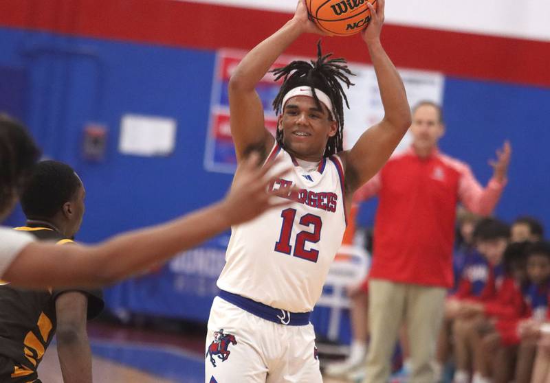 Dundee-Crown’s Anthony Spain looks for an option against Jacobs in varsity boys basketball on Friday, Dec. 12, 2025, at Dundee-Crown High School in Carpentersville.