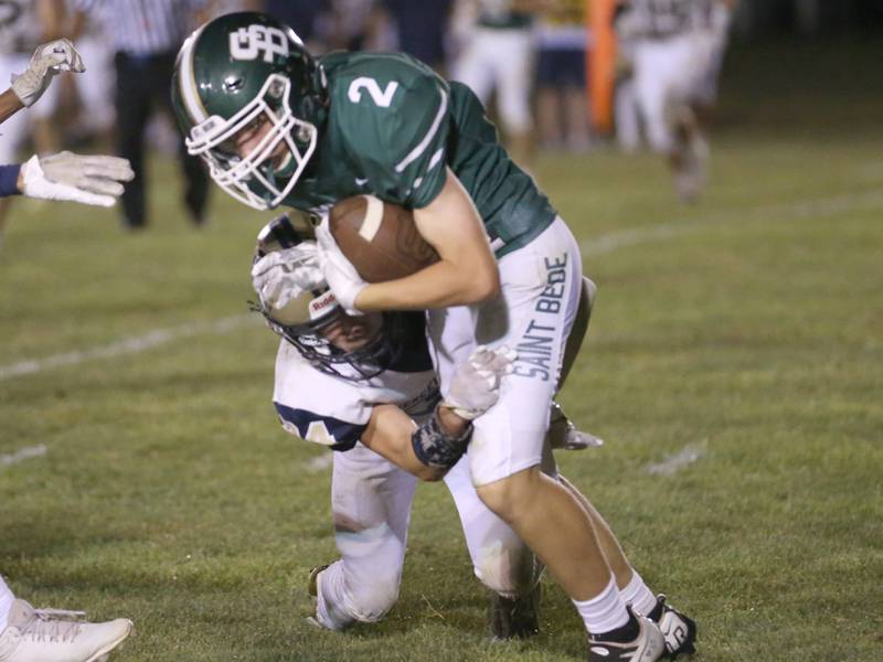 St. Bede's Carson Riva is stopped by Mercer County's Tannen James Whitehall on Friday, Sept. 1, 2023 at St. Bede Academy.