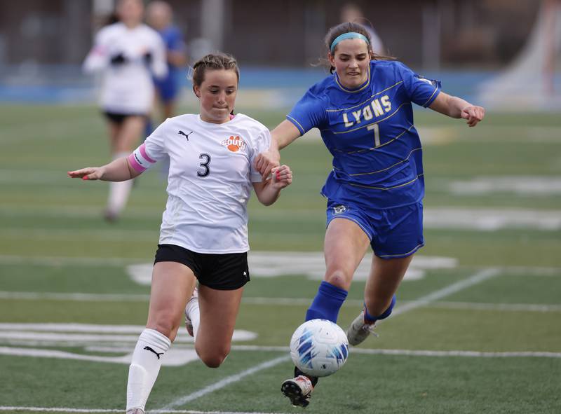Wheaton Warrenville South's Brooke Ittersagen (3) goes for the ball against against Lyons Township's Caroline Mortonson (7) during the girl's varsity soccer match between Lyons Township and Wheaton Warrenville South high schools on Thursday, March 27, 2025 in Western Springs.