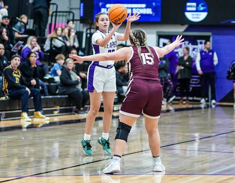 Plano's Josie Larson (23) shoots a three pointer against Marengo’s Emilie polizzi (15) during a basketball game at Plano High School on Wednesday, January 29, 2025.