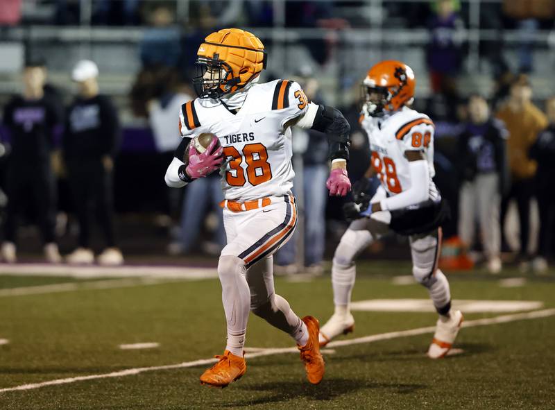 Wheaton Warrenville South's Amar'e Williams (38) runs during the 7A first-round playoff game between Wheaton Warrenville South and Downers Grove North high schools on Friday, Nov. 1, 2024 in Downers Grove.