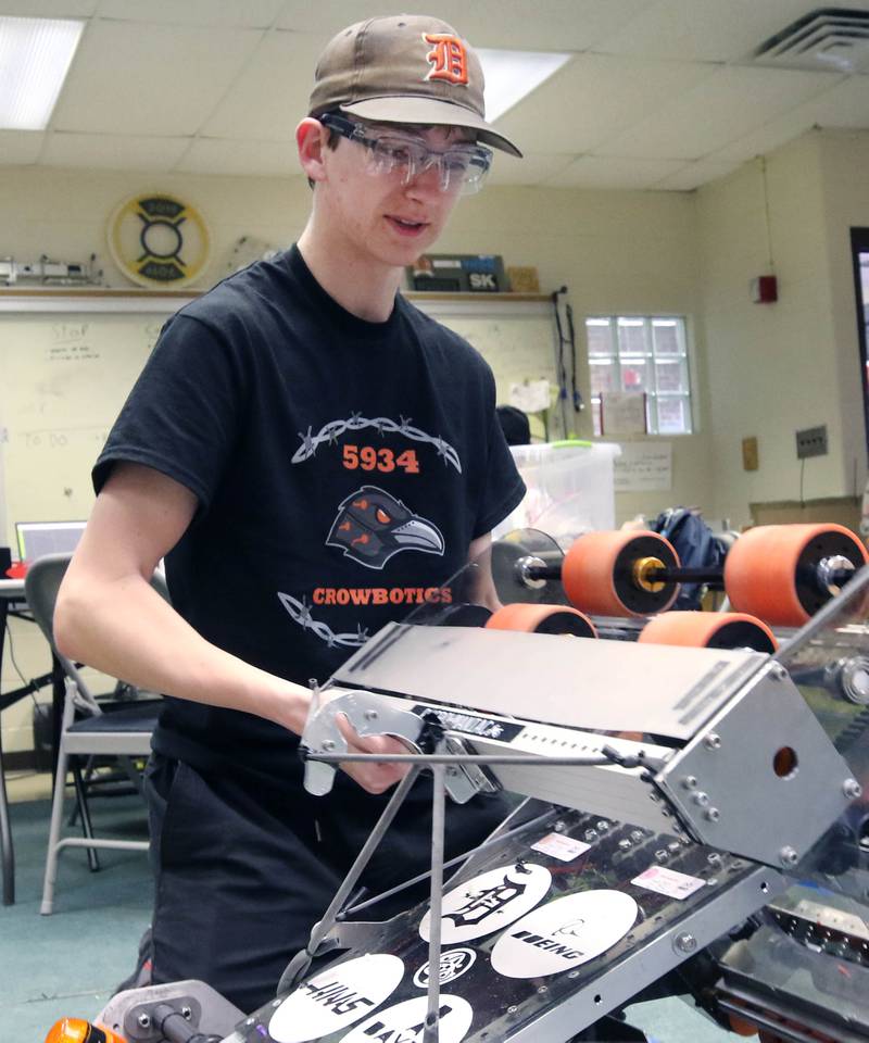 Blake Bollow, a senior at DeKalb High School, works on his teams robot during a Crowbotics team meeting Tuesday, April 10, 2024, at Huntley Middle School in DeKalb. Crowbotics is DeKalb High School’s robotics team who has qualified to compete in the FIRST Robotics Competition World Championship held in Houston, Texas April 17-20.