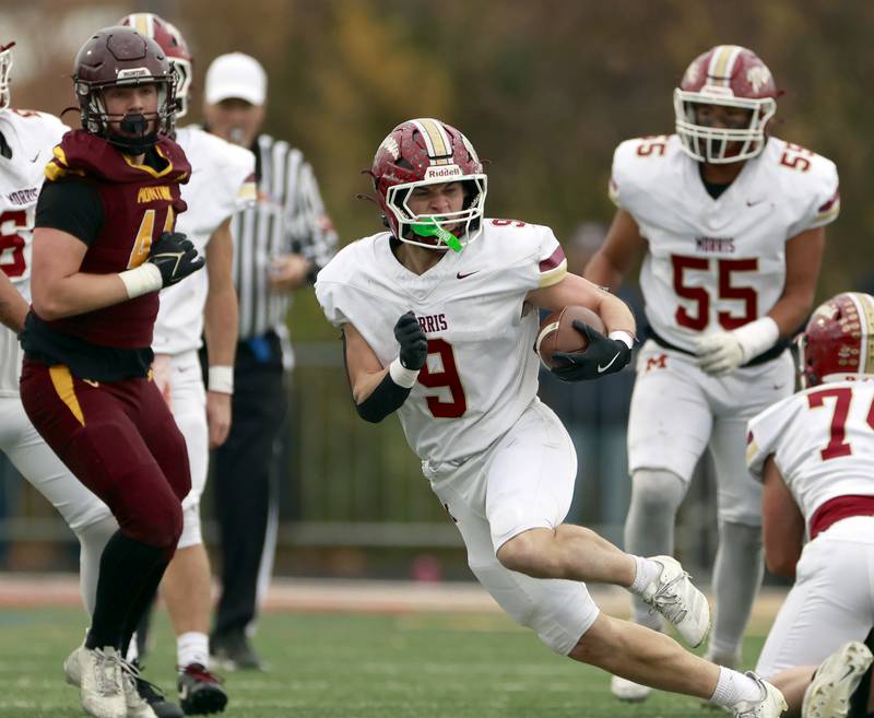 Morris' Caeden Curran (9) looks for more running room during the IHSA Class 4A semifinals football playoff game Saturday, Nov. 22, 2025 in Lombard.