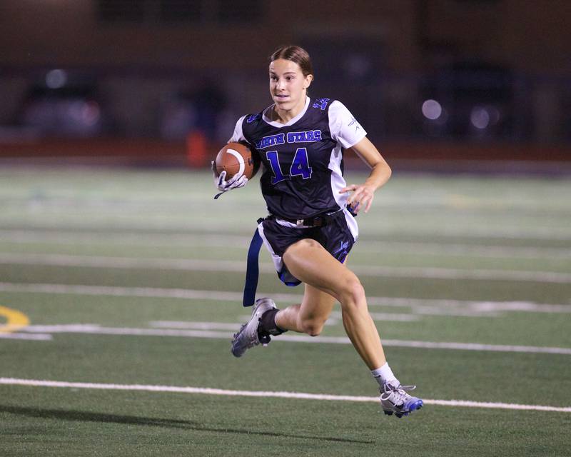St. Charles North's Kaelie Tomalak runs the ball for a gain against St. Charles East on Monday, September 29, 2025 in St. Charles.