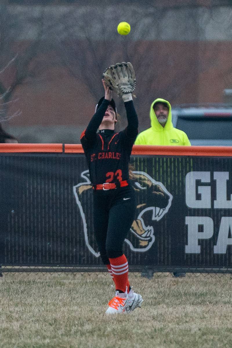 St.Charles East's Madelyn Royer (23) catches a fly-ball for an out against Yorkville during a softball game at St.Charles East High School on Wednesday, Mar 22, 2023.