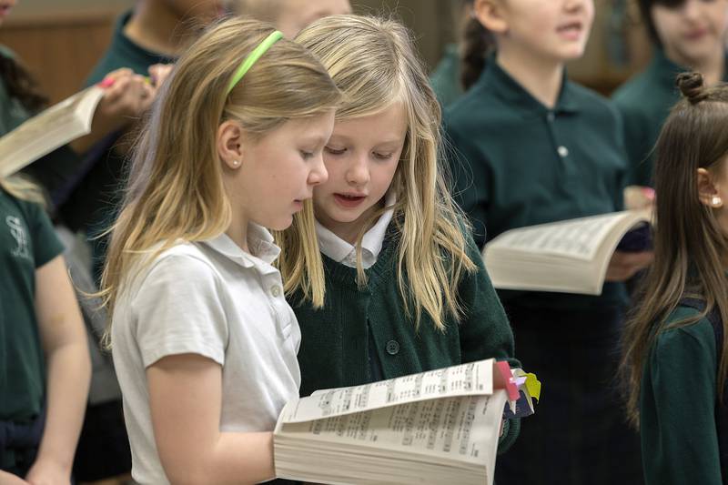 St. Andrew’s first through third grade students sing for residents Thursday, Jan. 30, 2025, at Morningside of Sterling. The senior living facility was one of two facilities the school visited as part of their community outreach.