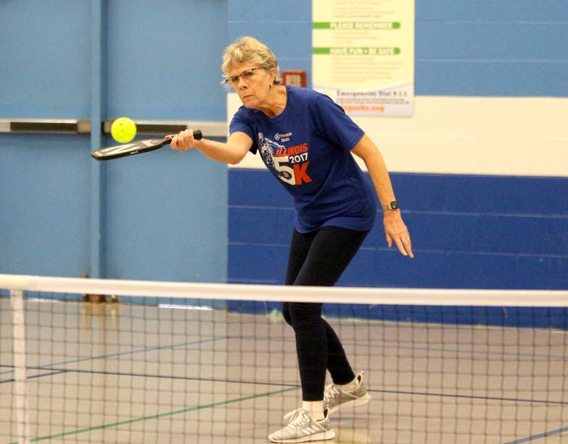 Janet Ballweg of St. Charles returns the ball during a pickle ball open gym session at the Pottawatomie Community Center in St. Charles on Jan. 23, 2023.