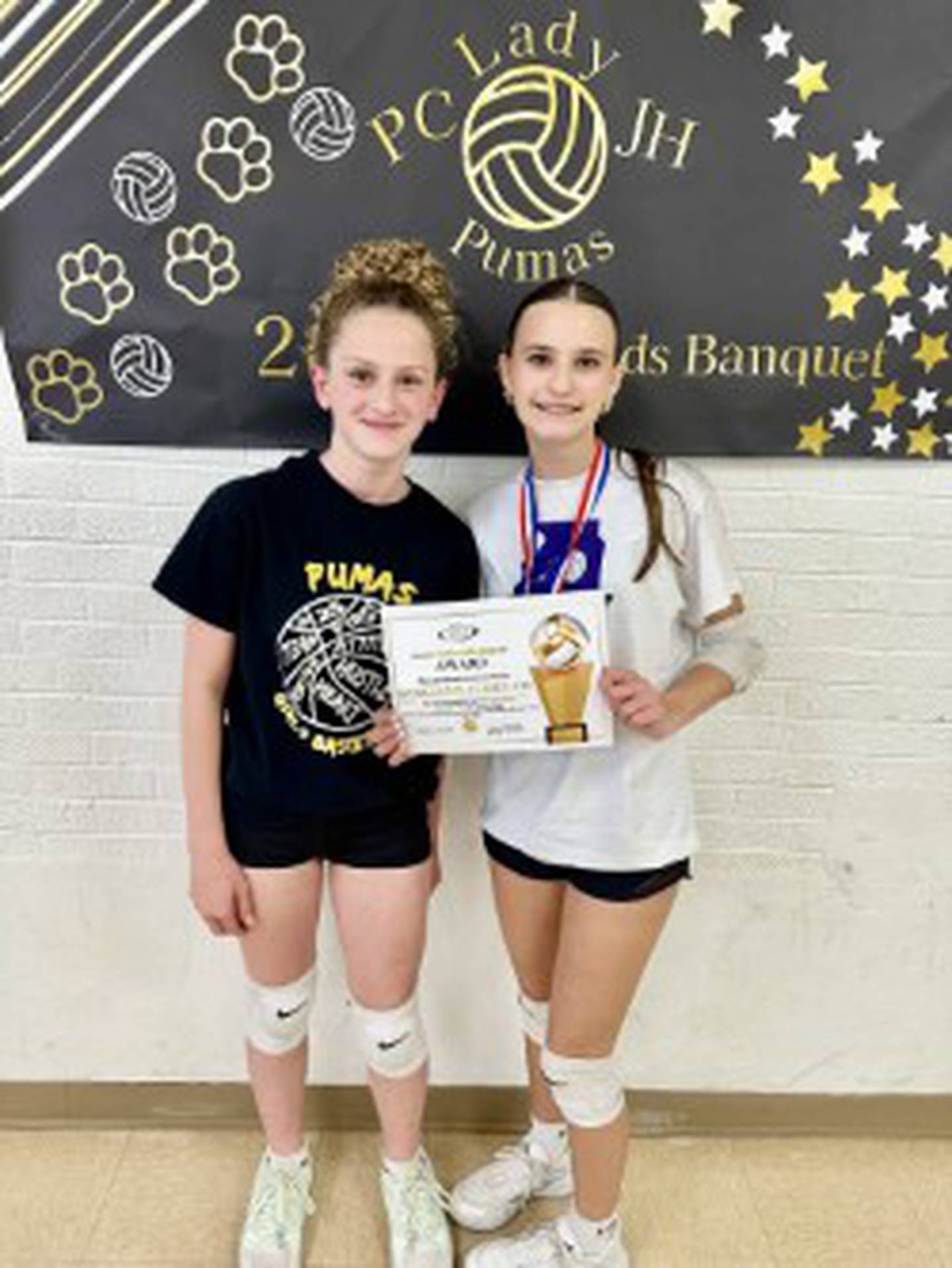 Brynn Chamberlain (left), Guillianna Cimei and Reagan Douehling (not pictured) were named co-MVPs for the Putnam County 7th grade volleyball team.