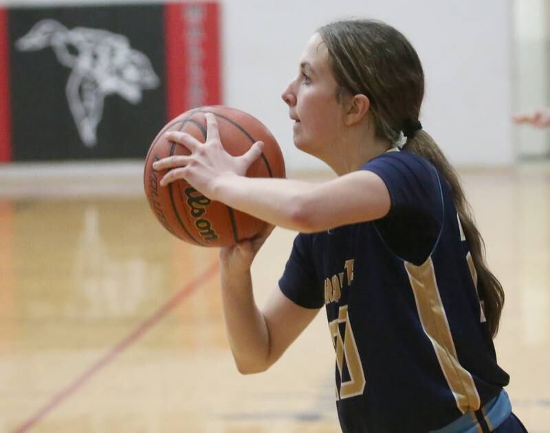 Marquette's Kaitlyn Davis shoots a wide-open jump shot against Midland during the Tri-County Conference Tournament third-place game on Thursday, Jan. 18, 2024 at Henry-Senachwine High School.