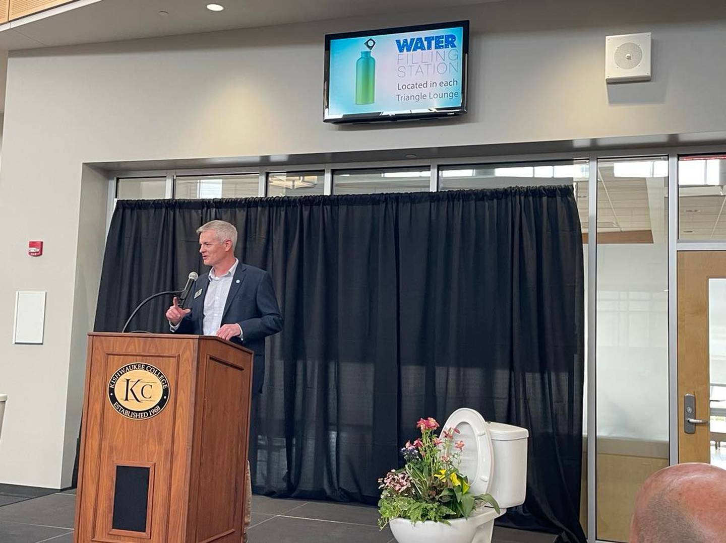 Mark Eddington, Executive Director of the Kishwaukee Water Reclamation District speaks during sanitary extension groundbreaking ceremony Friday, April 8 at Kishwaukee college.