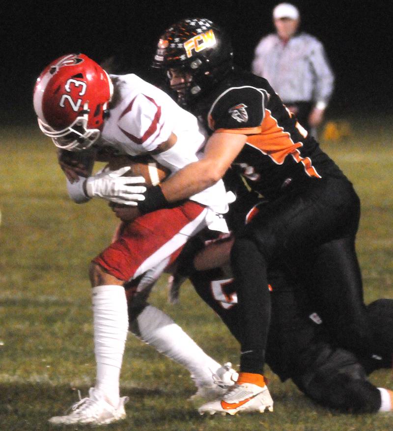 Flanagan-Cornell/Woodland's Kesler Collins takes down South Beloit's Dez Hampton at Woodland on Friday, Oct. 13, 2023.