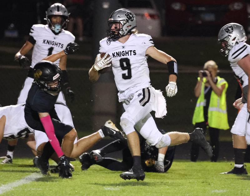 Kaneland's Carter Grabowski runs by a Sycamore defender on his way to the endzone during their game Friday, Oct. 3, 2025, at Sycamore High School.