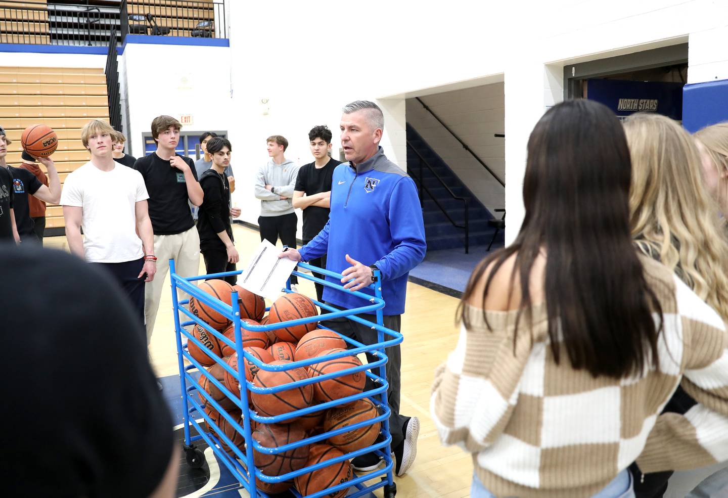 St. Charles North Head Baseball Coach Todd Genke as third-base coach during a recent game against Kaneland High School. Genke, who has been coaching the North Stars since 2004, also teaches driver’s education, health and physical education at the school.
