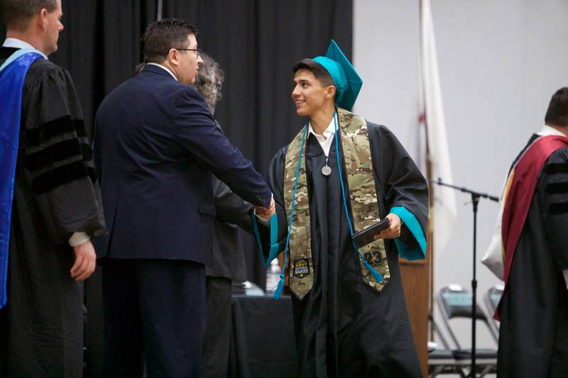 Joshua Rendon receives diploma at Woodstock North's Graduation Ceremony on Saturday, May 13, 2023 in Woodstock.
