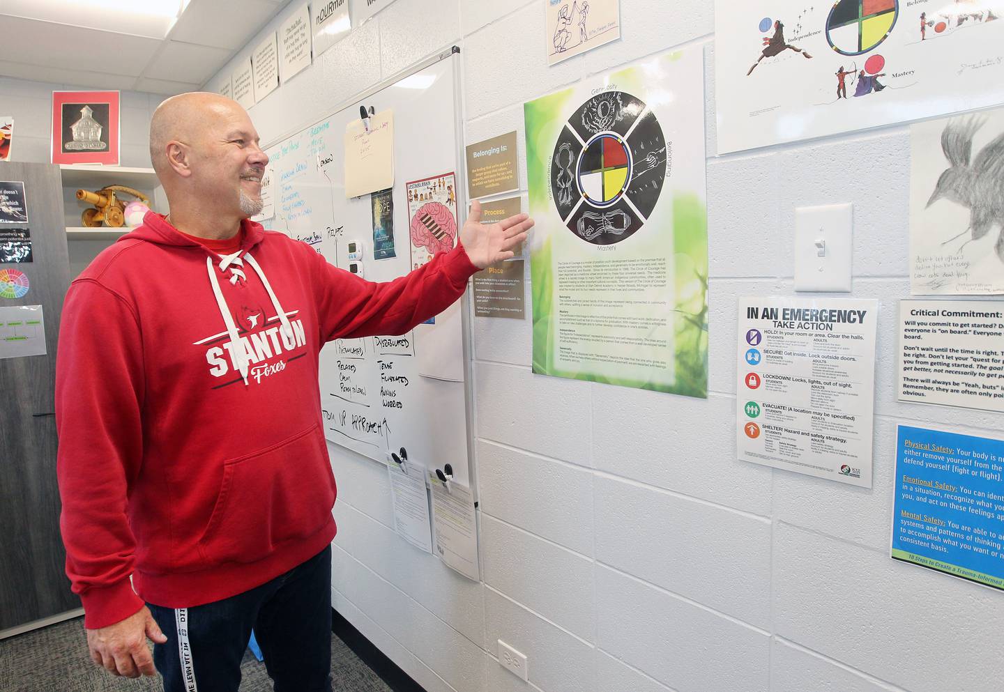 Stanton Middle School Principal Jeff Sefcik highlights the “Circle of Courage” model displayed in his office. This model is a key part of the school’s commitment to supporting student growth through belonging, mastery, independence, and generosity.