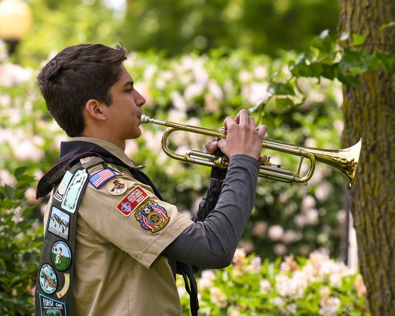 Scout member Christian Dominguez preforms Taps during the Memorial Day event on Monday May 26, 2025, held at Town Square Park in Yorkville.