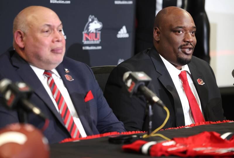 Northern Illinois University head football coach Thomas Hammock (right) answers a question as vice president and director of athletics and recreation Sean Frazier listens during a press conference Tuesday, Jan. 7, 2025, announcing that NIU football will be joining the Mountain West Conference starting with the 2026 season.
