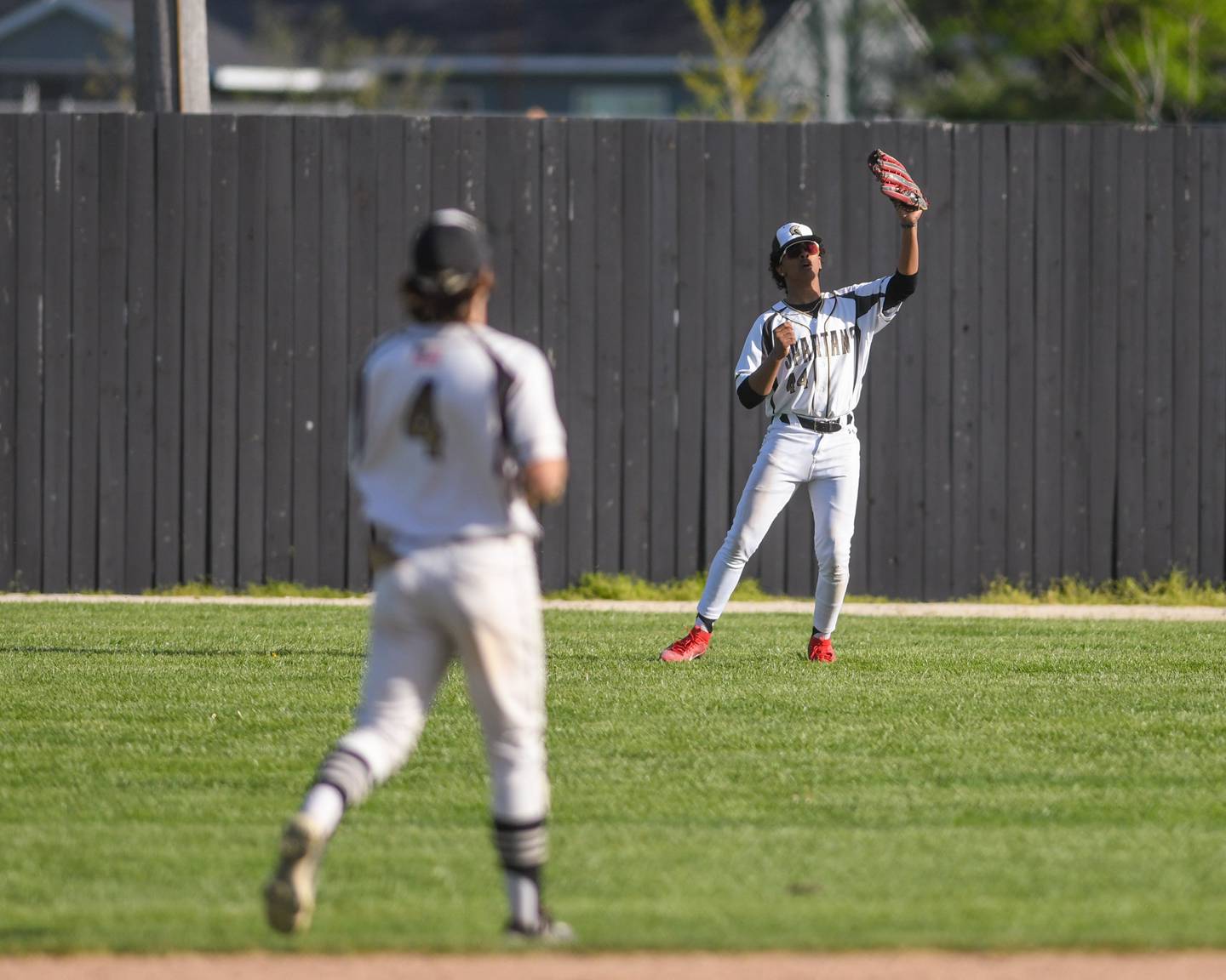 Sycamore's Tyler Townsend, right, catches the ball during the game on Wednesday May 1, 2024, while taking on Morris High School.