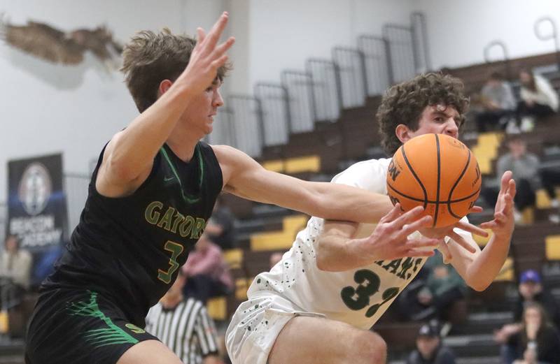Crystal Lake South’s Nick Stowasser, left, battles Grayslake Central’s Mitchell Ross during Hinkle Holiday Classic varsity boys basketball tournament action on Thursday, Dec. 26, 2024 at Jacobs High School in Algonquin.