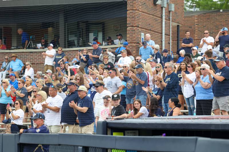 Ottawa Marquette fans cheer as the Crusaders secured a 16-1 victory in four innings over Lexington in the IHSA Class 1A State semifinal on Friday, June 6, 2025.