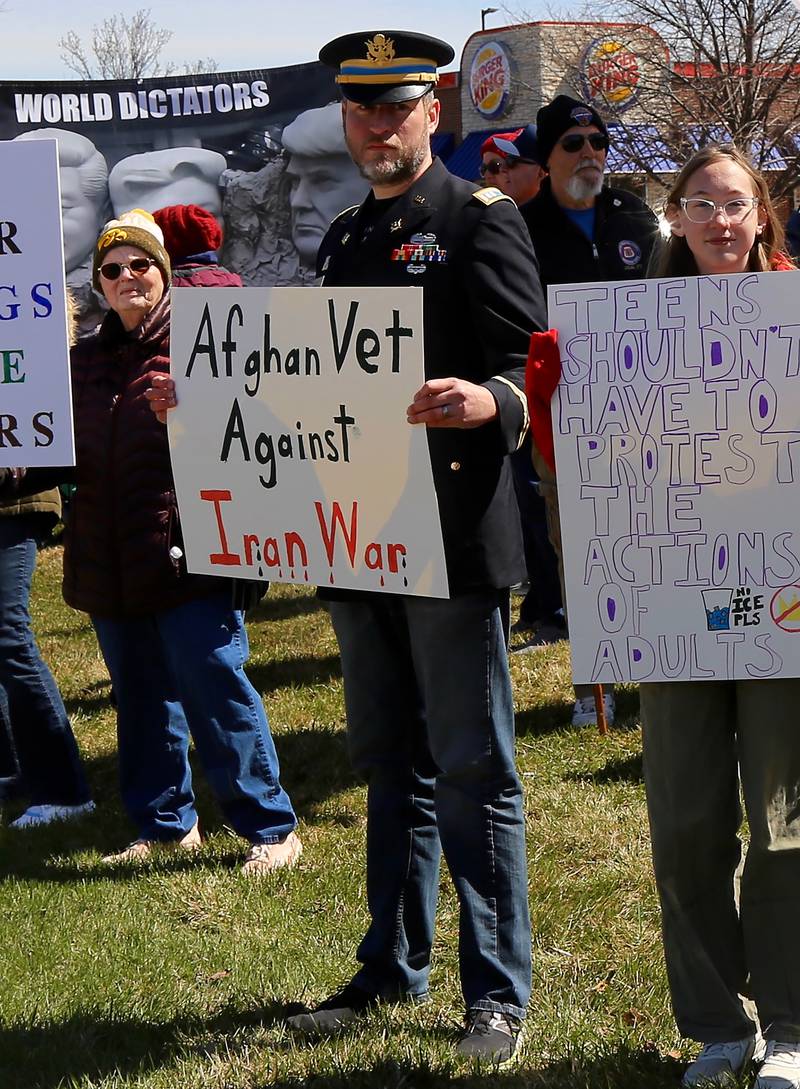 Protesters against the Trump administration attend the No Kings demonstration along U.S. Route 34 in Oswego on Saturday, March 28, 2026.