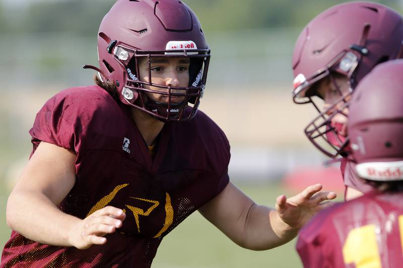 Brock Wood prepares to make a tackle during practice with the varsity football team at Richmond-Burton High School on Wednesday, July 14, 2021 in Richmond.