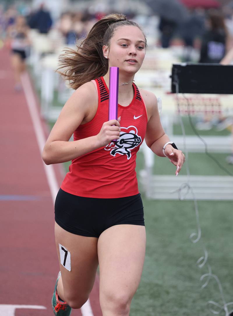 Lincoln Way Central's Ava Dughetti runs the anchor leg of the 4 X 800 relay during the girls varsity track and field 3A Lockport sectional on Friday, May 12, 2023.